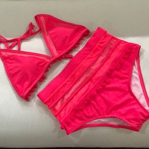 Two piece bathing suit in bright pink
